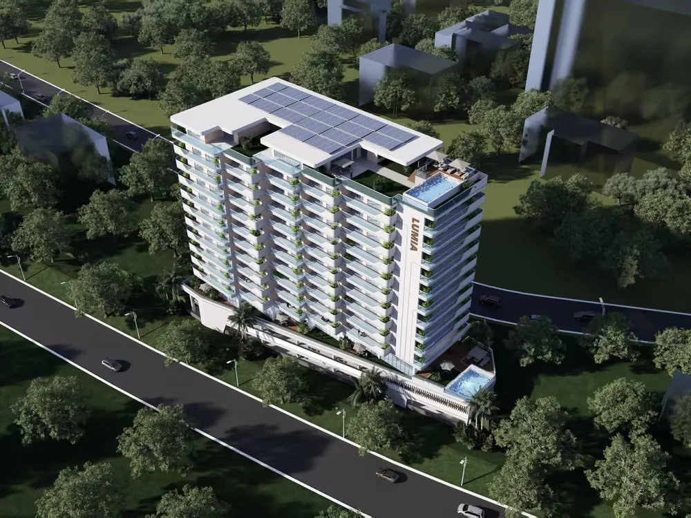 Mixed-use complex concept view — hotel tower and low-rise blocks on a landscaped lawn