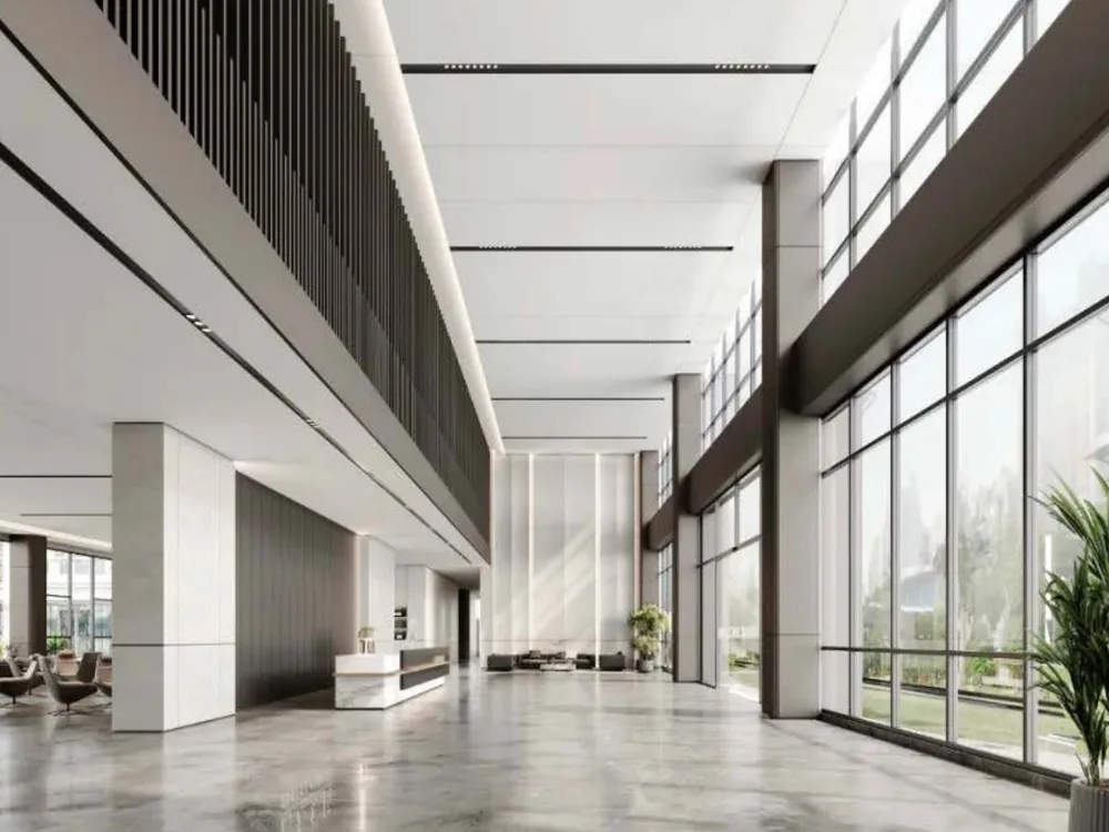 Hotel lobby with full-height glazing, stone columns and a reception desk