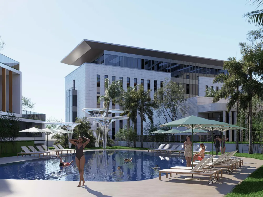 Resort courtyard pool with shaded loungers between the residential blocks
