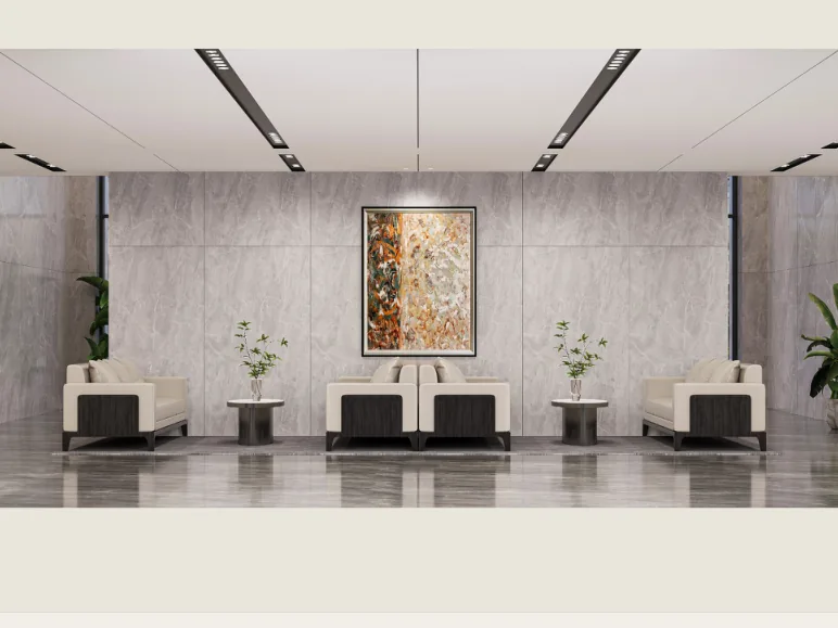 Lift lobby with stone cladding, artwork and lounge seating