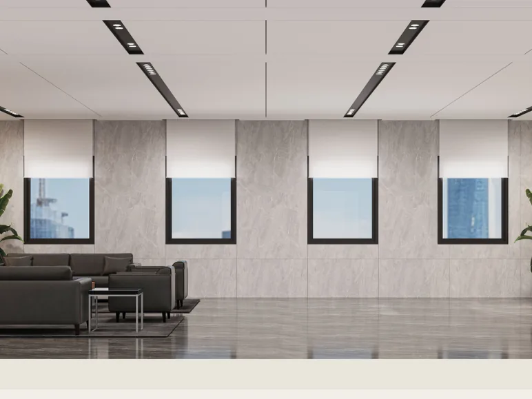 Mezzanine lift lobby with timber panels, stone walls and dark lounge seating