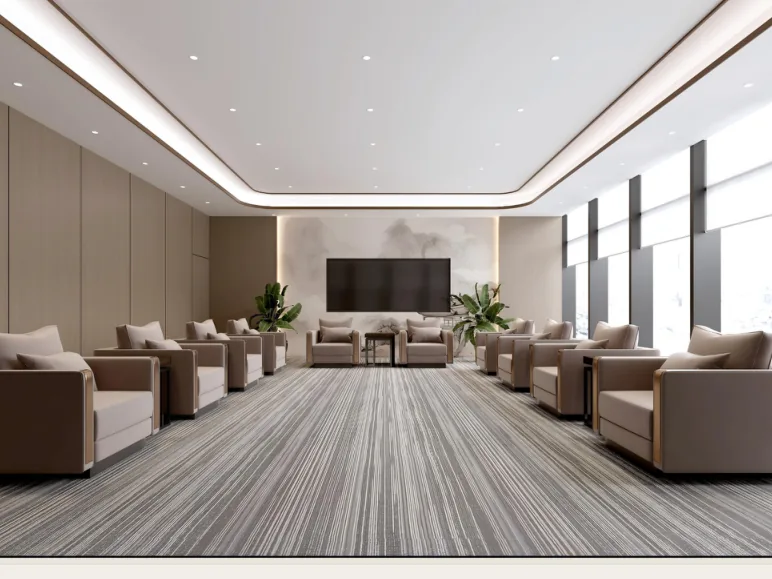 VIP reception lounge with upholstered armchairs and a wall-mounted screen