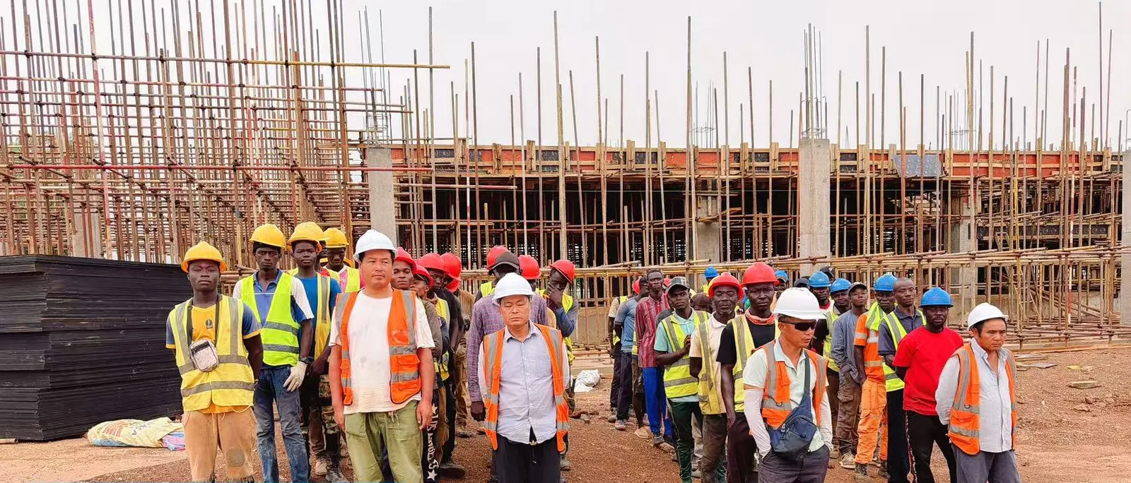 China-led site team at the morning briefing on a construction site in Ouagadougou