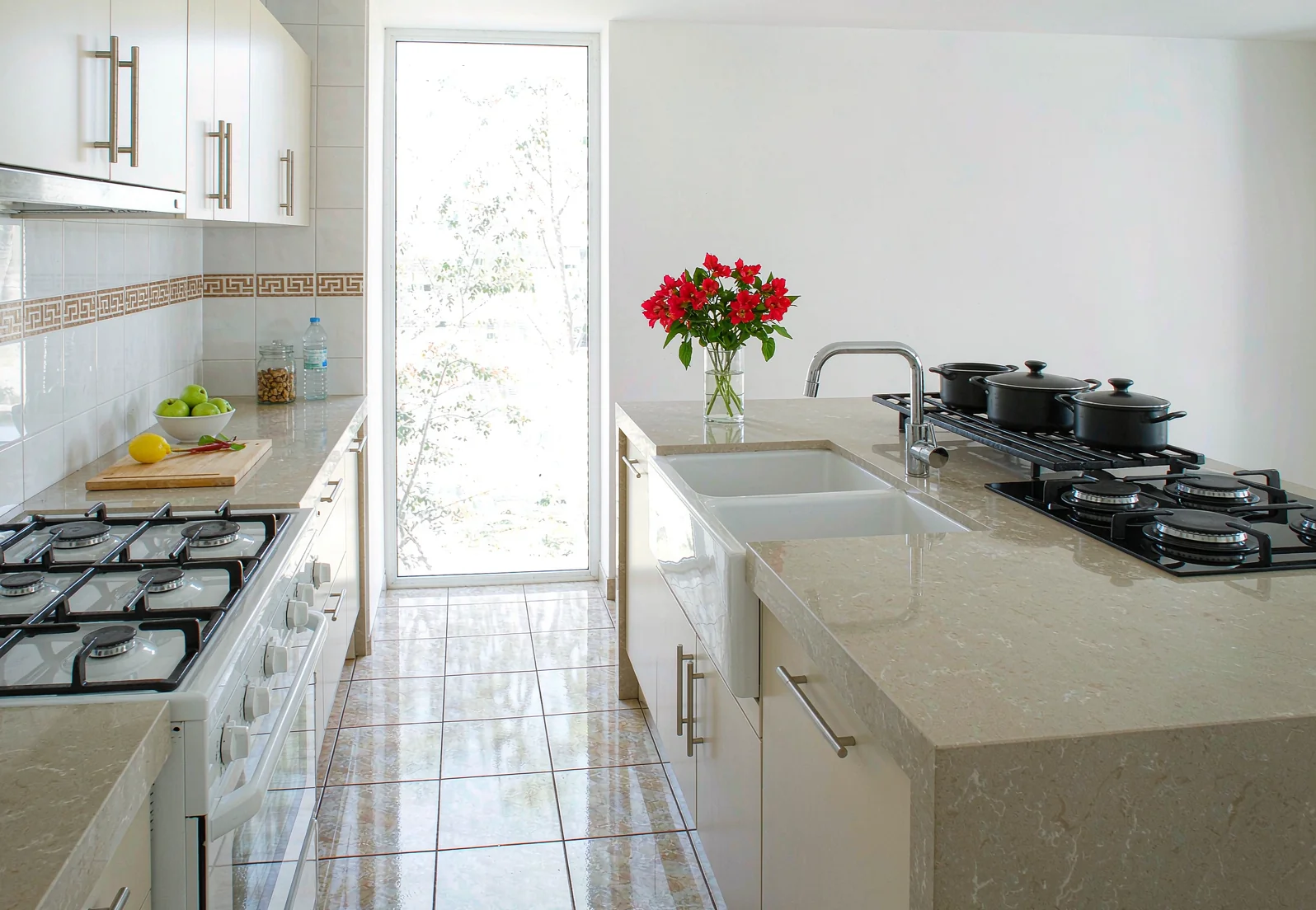 Kitchen floor and splashback tiled in porcelain